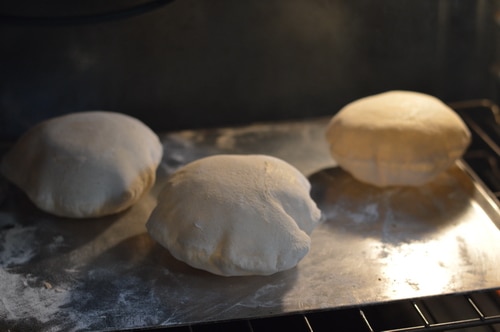 https://joybileefarm.com/wp-content/uploads/2011/06/Pita-in-the-oven.jpg