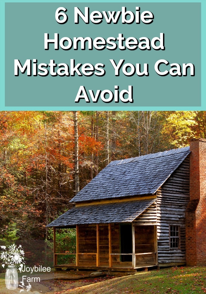A farm house with autumn foliage in the background