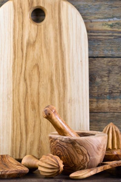 Picture of wooden cutting board and kitchen utensils