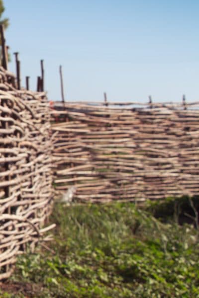 A fence made out of willow branches