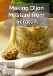 Glass jar of dijon mustard
