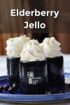 Elderberry Jello on a plate with whipped cream