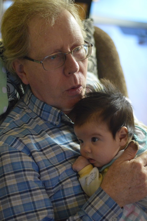 grandpa rocking baby