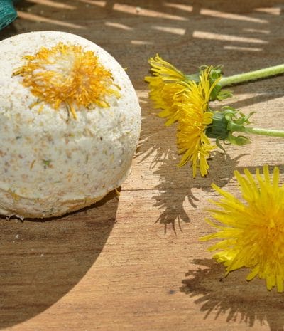 Dandelion bath bomb by fresh dandelion blossoms