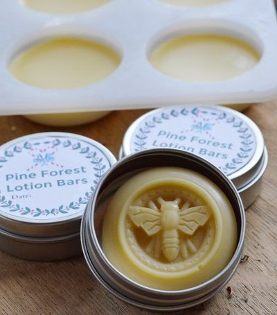 Homemade lotion bars in molds and tin containers